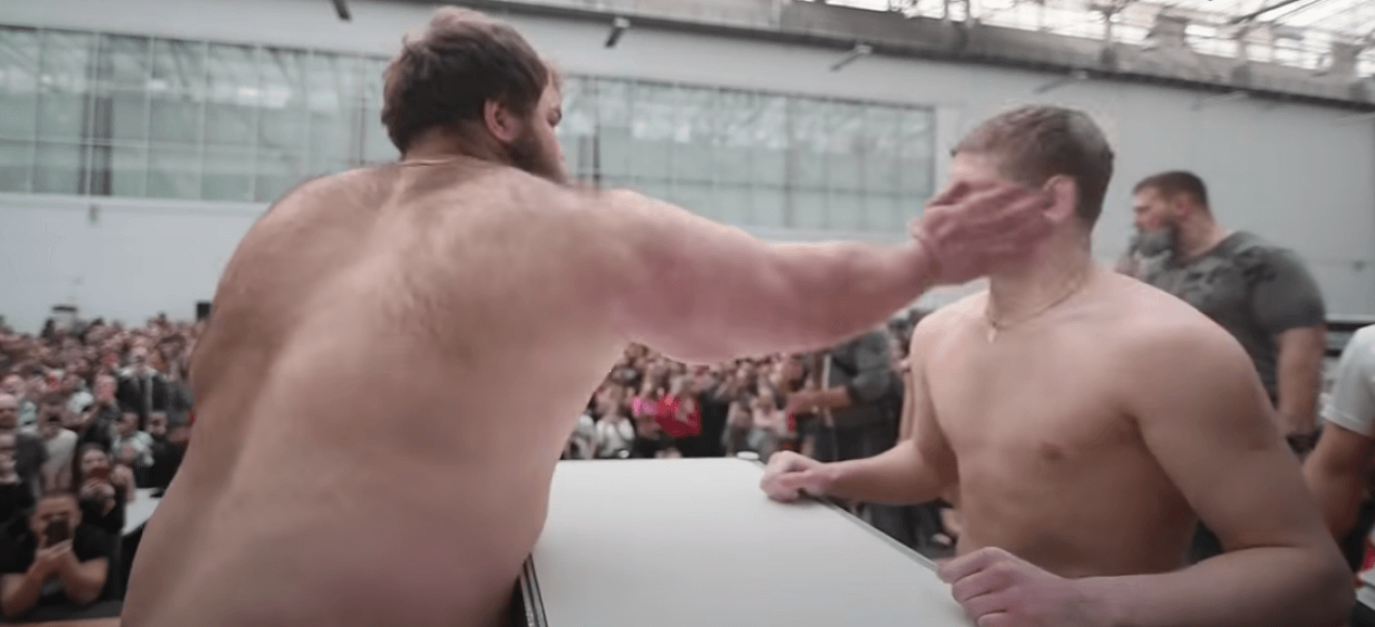 slapping competition russia viral video fat guy